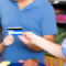 An image of a family shopping for groceries with an ebt card